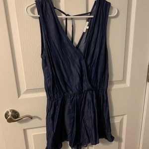 Chambray romper. V-neck with tie detail on back.